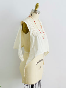 side image of 1910s Edwardian White Crochet Lace top with white embroidered cotton skirt on mannequin