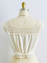 Load image into Gallery viewer, Back side of 1910s Edwardian White Crochet Lace top with pink high waisted pants on mannequin
