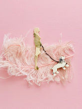 Load image into Gallery viewer, vintage 1920s flapper brooch with dog on ostrich feather pink background

