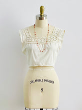 Load image into Gallery viewer, 1910s Edwardian White Crochet Lace top on mannequin with beaded coral necklace
