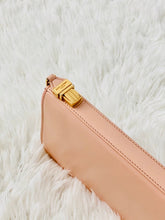 Load image into Gallery viewer, gold buckle of a pink YSL wallet
