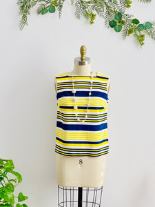 1960s yellow and blue striped top with side square buttons on mannequin