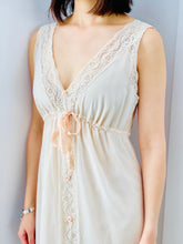 Load image into Gallery viewer, lace detail of a model wearing a white vintage Christian Dior lingerie dress with ribbon ties
